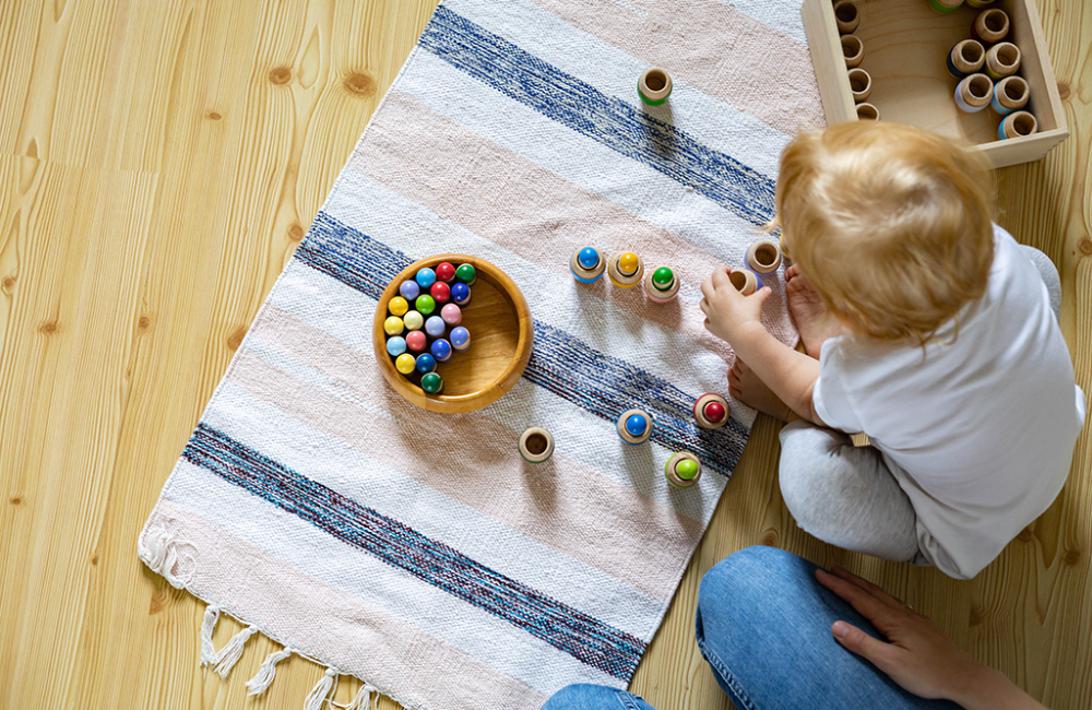 mother-child-playing-educational-game-gnomes-barrels-use-maria-montessori-method-development-lowres