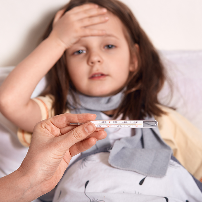 mother-holding-thermometer-hands-sick-little-girl-lying-bed-keeping-her-palm-forehea-suffering-from-high-temperature-lowres